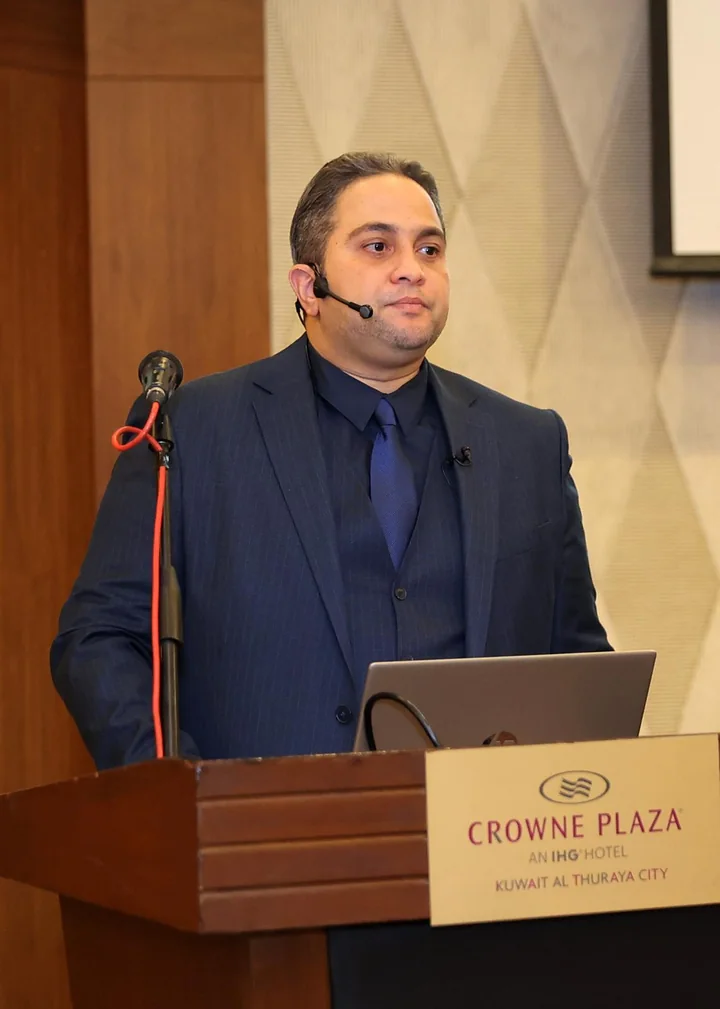 Dr. Sherif Sharafeldin presenting a medical lecture in Kuwait